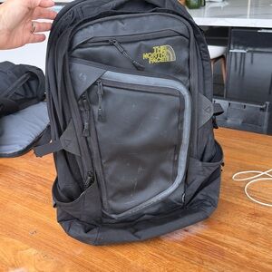 The North Face Black Backpack with Yellow Logo